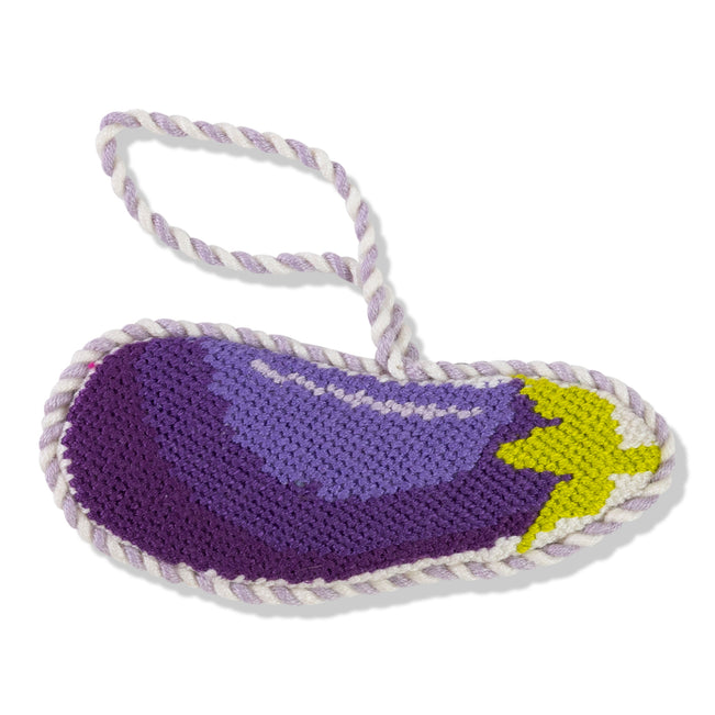 Purple eggplant-shaped toy with a yellow stem on a white background