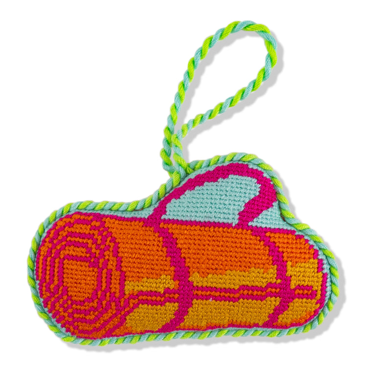 Colorful knitted heart-shaped keychain with a pattern on a white background