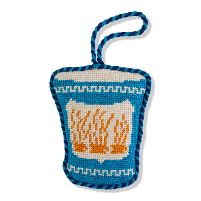 Crocheted bag with a design of flames on a white background