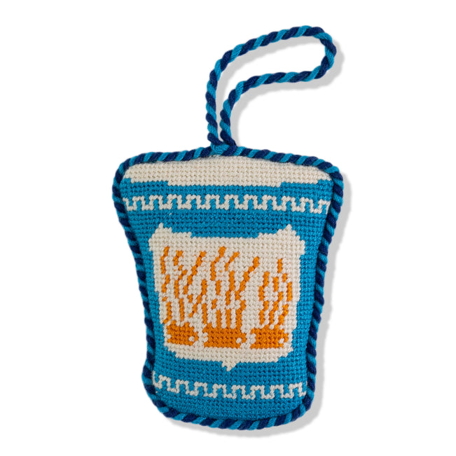Crocheted bag with a design of flames on a white background