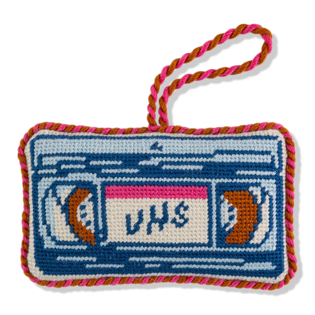 Crocheted VHS tape with colorful yarn on a white background
