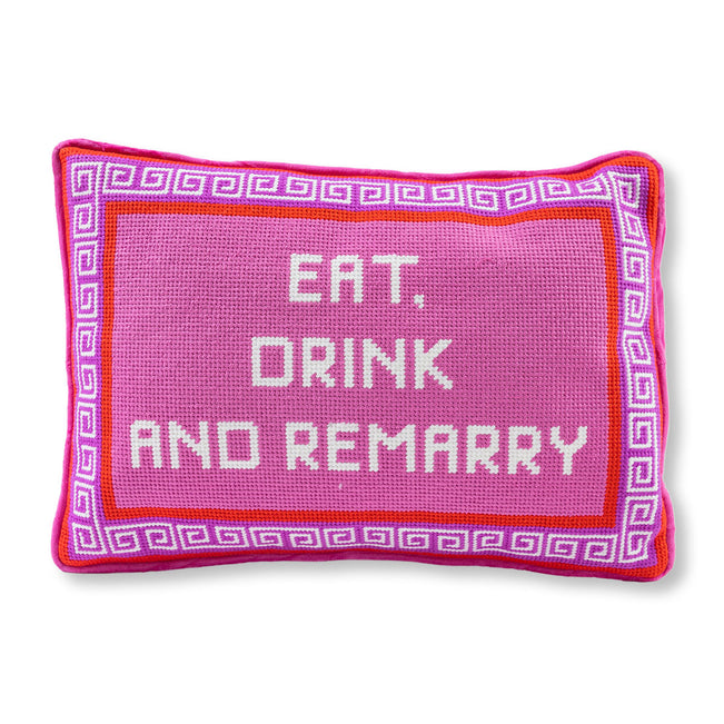 Pink pillow with 'Eat, Drink and Remarry' text on a white background
