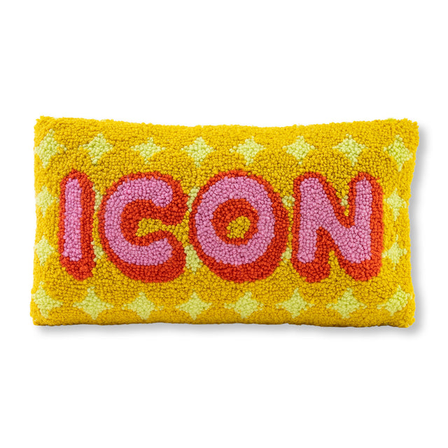 Yellow pillow with 'ICON' text in pink and red on a white background
