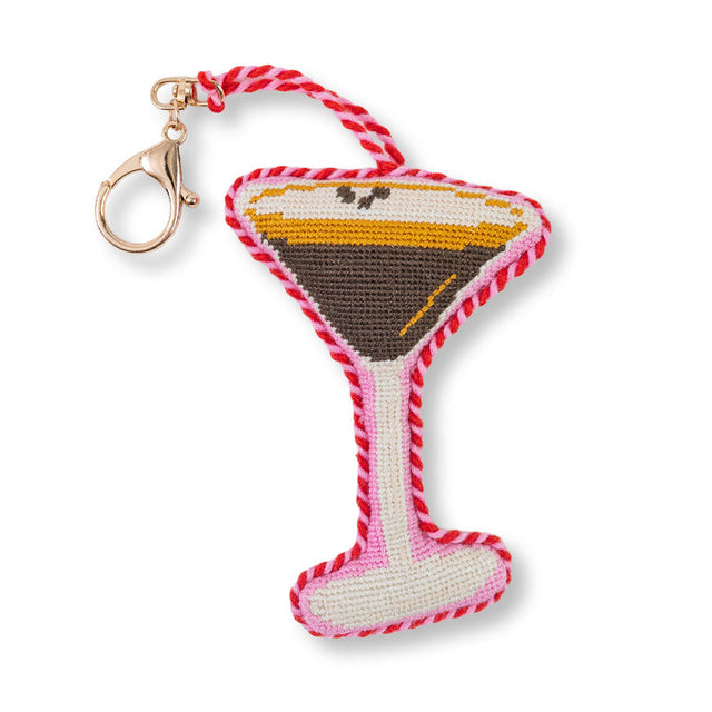 Martini glass keychain with red and white rope on a white background